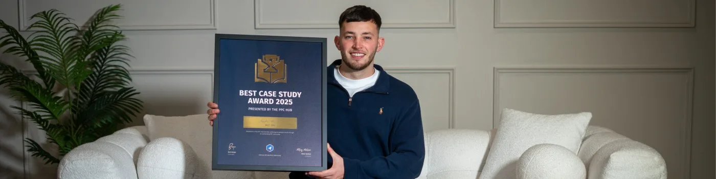 Taylor Housden at home with the framed Best Case Study Award 2025